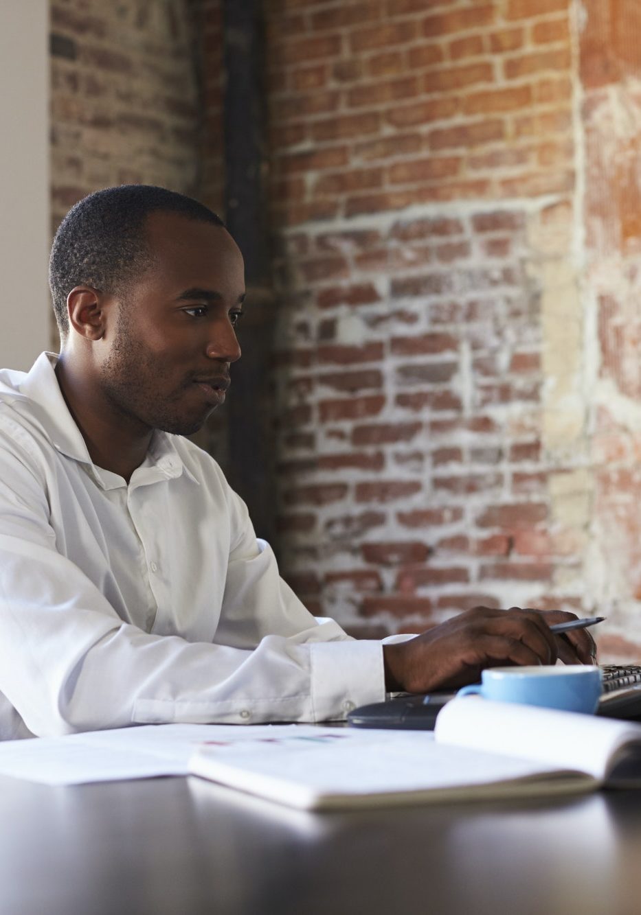 Businessman Working On Computer In Office